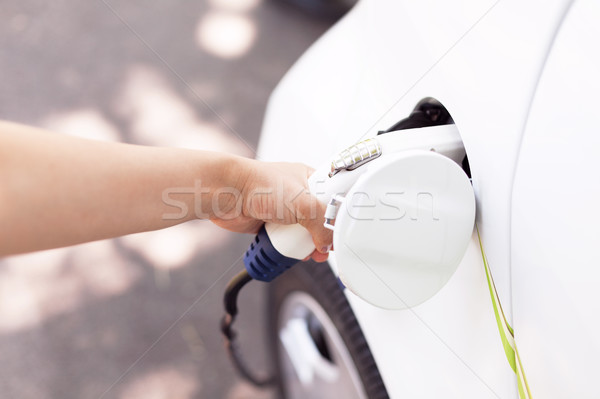 Charging battery of an electric vehicle Stock photo © wellphoto