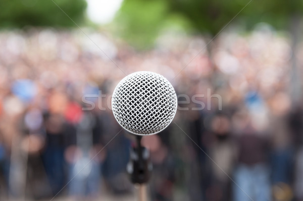 Microphone in focus against blurred crowd. Political rally. Stock photo © wellphoto