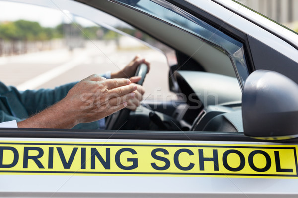 Learner driver student driving car with instructor Stock photo © wellphoto
