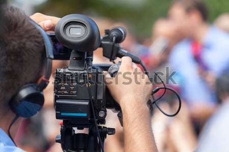 Filming an event with a video camera Stock photo © wellphoto