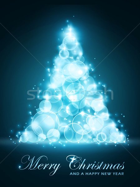 Stock photo: Blue glowing Christmas tree made of out of focus light dots