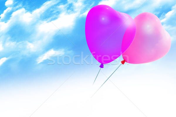 Colored balloons in a heart shape on blue sky   Stock photo © Wikki