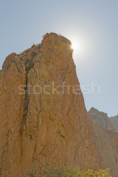 Stock photo: Desert Sun Peeking Around a Rock Monolith