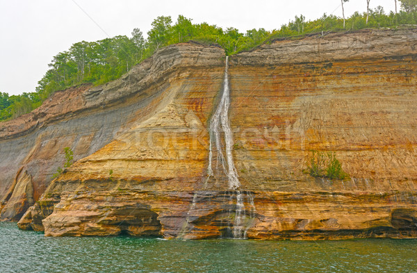 Colorful Falls on a Lakeshore Cliff Stock photo © wildnerdpix