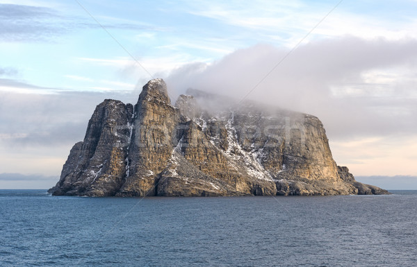 Tengerparti felhők terméketlen sziget tájkép köd Stock fotó © wildnerdpix