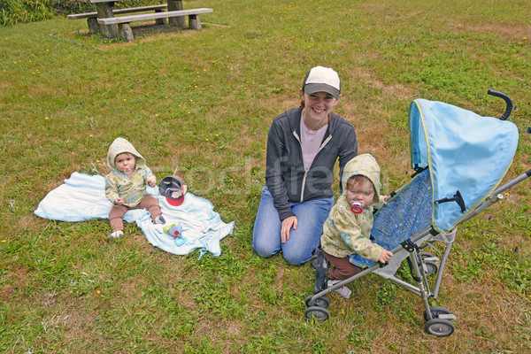Mom Watching Her Twins in the Park Stock photo © wildnerdpix