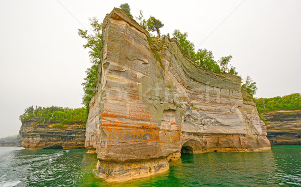 Jagged Rock on a Colorful Lakeshore Stock photo © wildnerdpix