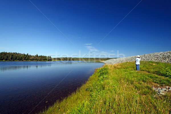Hiker looking at a coastal lagoon Stock photo © wildnerdpix