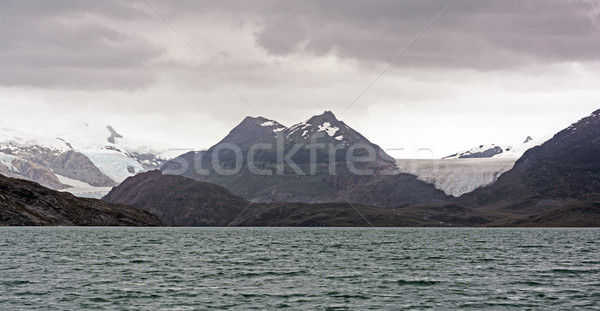 Tengerparti egyenetlen tájkép gleccser hegyek távoli Stock fotó © wildnerdpix