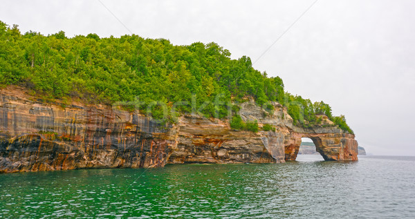 Sea Arch on Colorful Cliffs Stock photo © wildnerdpix
