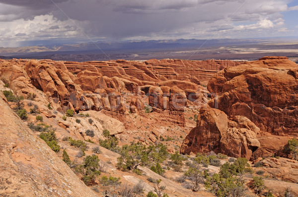 Viharfelhők piros kő kanyon uszony park Stock fotó © wildnerdpix