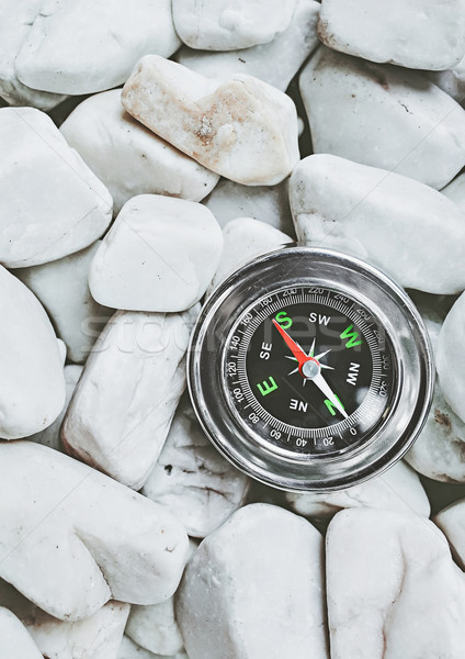 compass on pebbles Stock photo © winnond