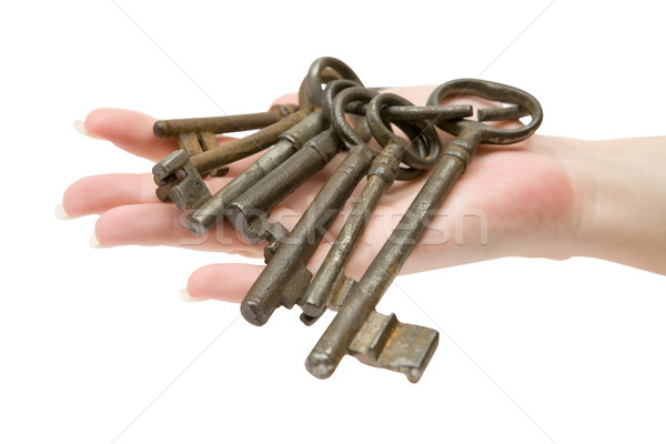 Roestige sleutels vrouwelijke hand sleutelhanger Stockfoto © winterling