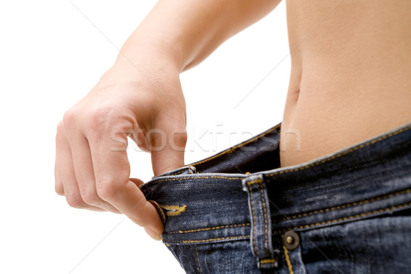 Bem sucedido dieta mulher jeans isolado Foto stock © winterling