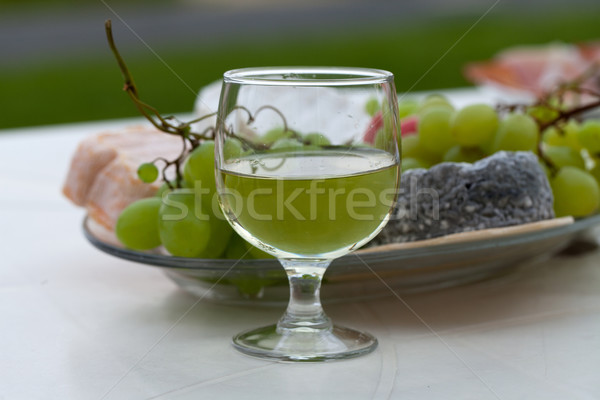 Various sorts of cheese, grapes and glass of the white wine Stock photo © wjarek