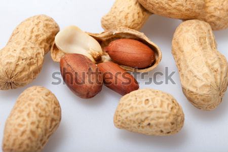 Dried peanuts in closeup on the white background Stock photo © wjarek