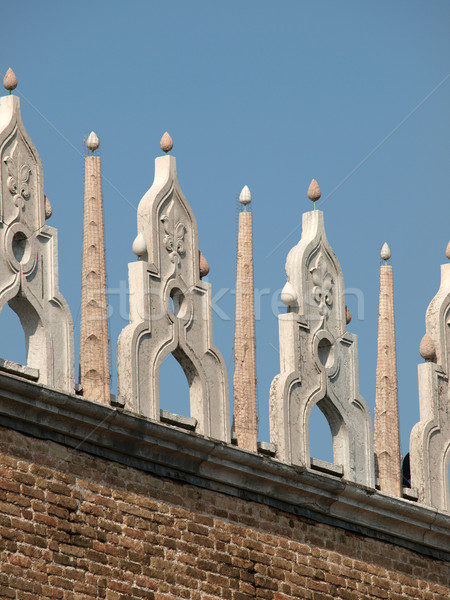 Characteristic architectural ornaments on the edge of a roof of the Doges' Palace in Venice Stock photo © wjarek