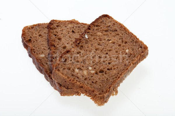Slices of dark bread isolated over white  Stock photo © wjarek