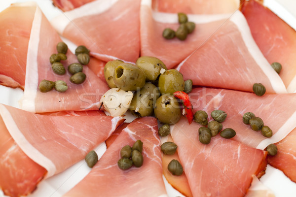 Prosciutto with olives and caper Stock photo © wjarek
