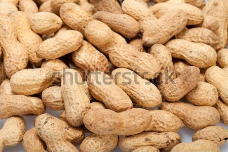 Dried peanuts in closeup on the white background Stock photo © wjarek