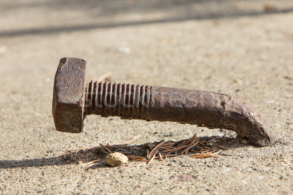 Rusty Bent Lag Bolt in Concrete Stock photo © wolterk