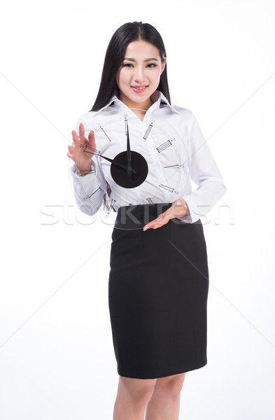 young woman holding a clock. Stock photo © wxin