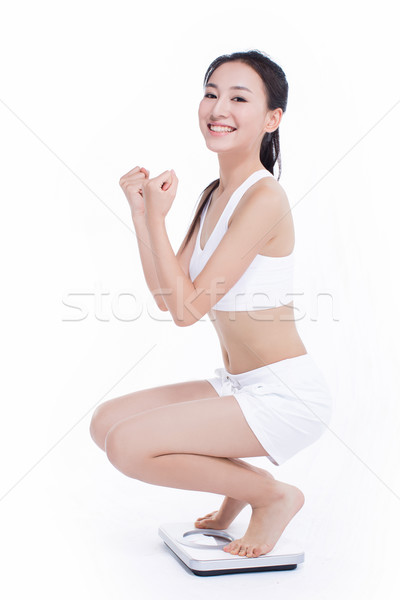 微笑的女人 浴室秤 亞洲的 女子 慶祝 歡呼 商業照片 © wxin