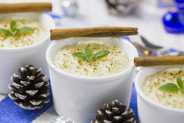 Rice Pudding with Cinnamon, New Year Ornaments in Blue Color, Pi Stock photo © x3mwoman
