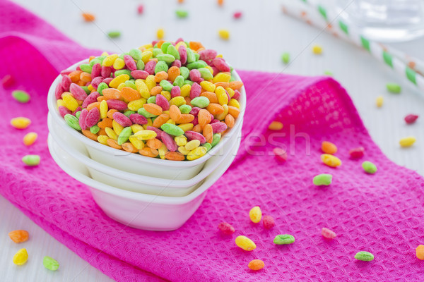 Colorful Rice Cereal on the pink dishcloth with glass of water a Stock photo © x3mwoman