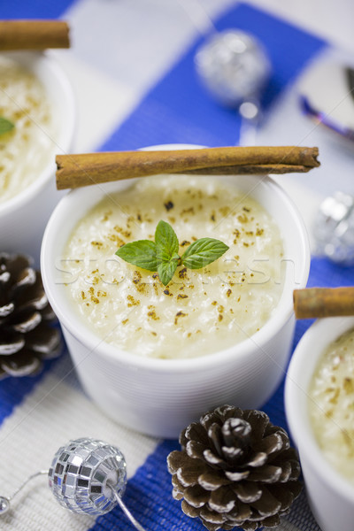 Rice Pudding with Cinnamon, New Year Ornaments in Blue Color, Pi Stock photo © x3mwoman