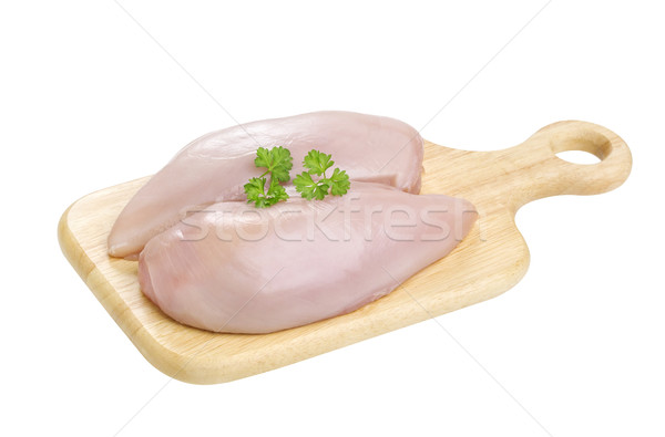 Chicken fillet breast on cutting board isolated on white background Stock photo © xamtiw