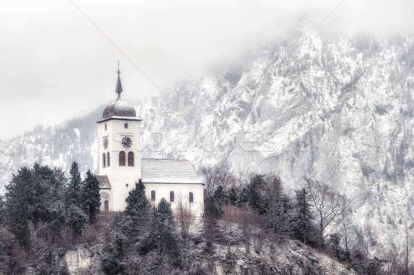 Cristian church on a snow covered hill in winter near Salzburg,  Stock photo © Xantana