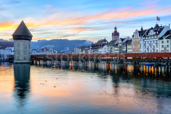 Wooden Chapel Bridge and Water Tower on sunset, Lucerne, Switzerland Stock photo © Xantana