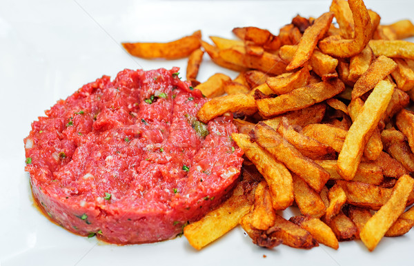 Steak tartare served with french fries potato chips Stock photo © Xantana