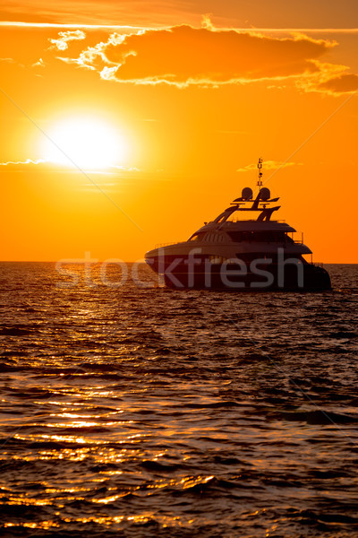 Stock photo: Luxury yacht on open sea at golden sunset