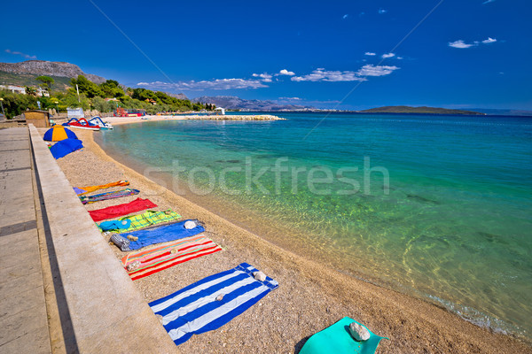 Towels on idyllic beach in Kastela bay Stock photo © xbrchx