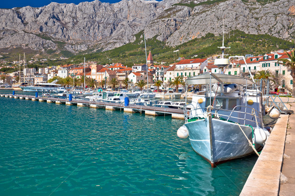Colorful Makarska boats and waterfront under Biokovo mountain vi Stock photo © xbrchx