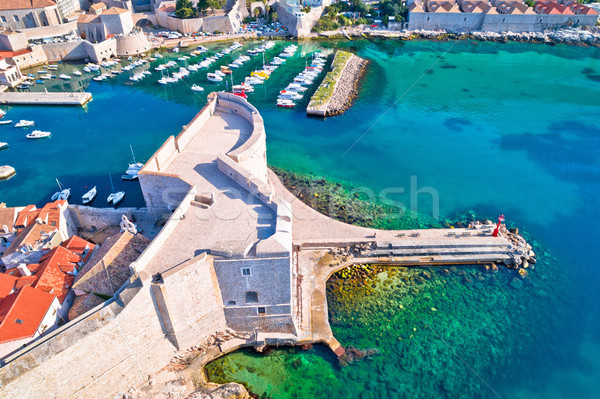 Dubrovnik harbor and strong defense walls aerial view Stock photo © xbrchx