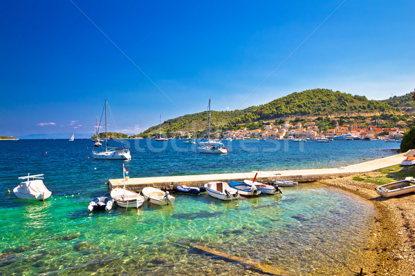 Turquoise beach and small harbor on Vis Stock photo © xbrchx