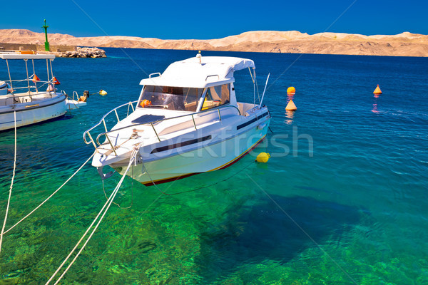 Floating boat on turquoise sea in Velebit channel Stock photo © xbrchx