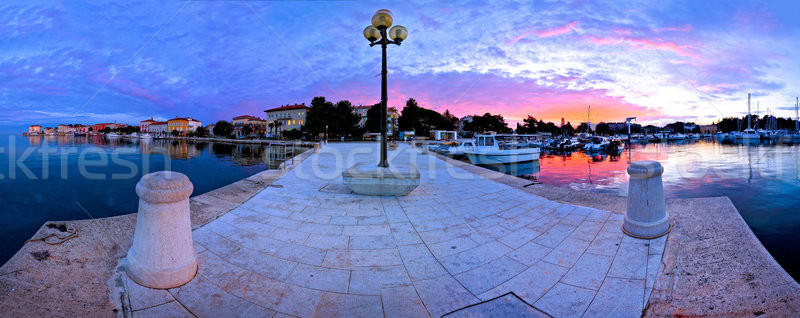 Town of Porec morning sunrise panoramic view from pier Stock photo © xbrchx