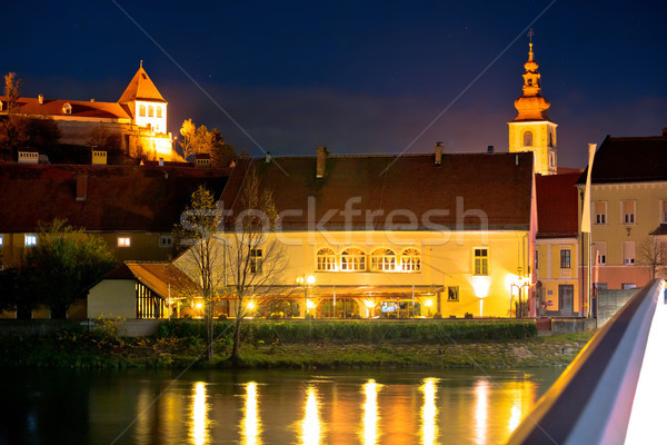 Old Town of Ptuj evening riverfront view Stock photo © xbrchx