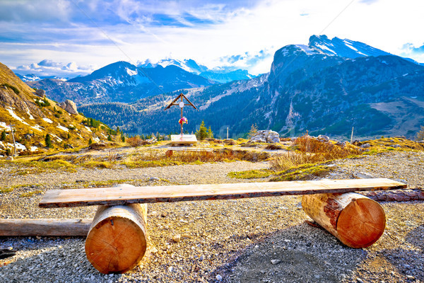 Bench and cross in Valparola Pass alpine destination Stock photo © xbrchx