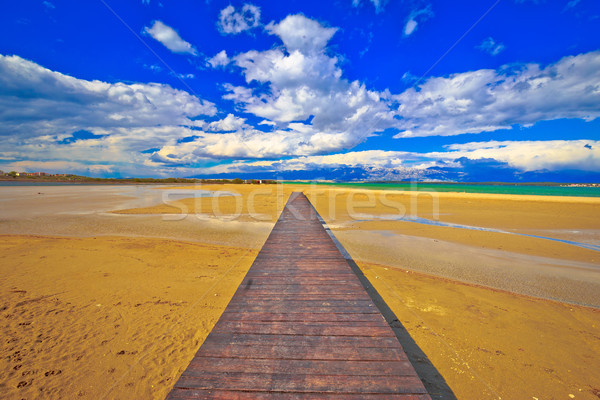Wooden boardwalk and sand beach of Nin Stock photo © xbrchx