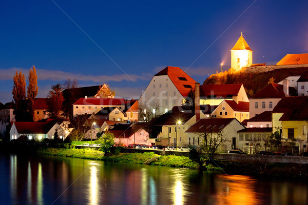 Town of Ptuj and Drava river evening riverfront view Stock photo © xbrchx