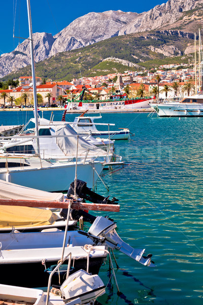Colorful Makarska boats and waterfront under Biokovo mountain vi Stock photo © xbrchx