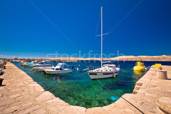 Floating boat on turquoise sea in Velebit channel Stock photo © xbrchx