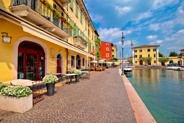 Lazise colorful harbor and boats view Stock photo © xbrchx