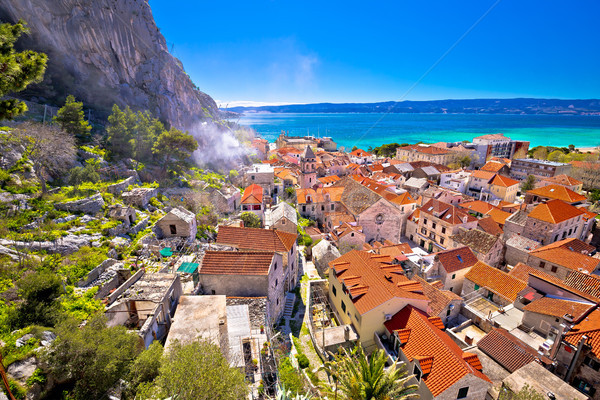 Town of Omis coast and rooftops panoramic view Stock photo © xbrchx