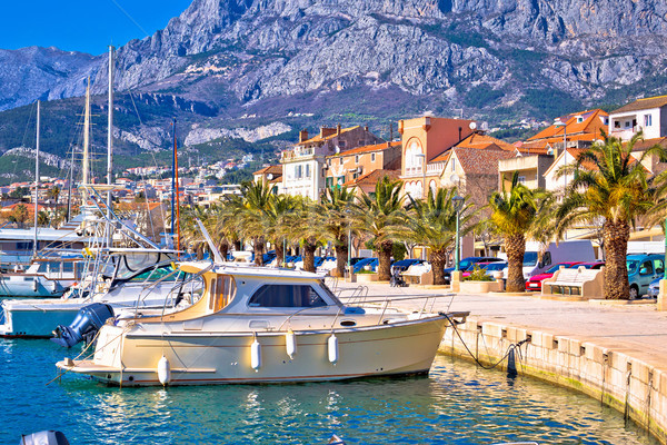 Colorful Makarska boats and waterfront under Biokovo mountain vi Stock photo © xbrchx
